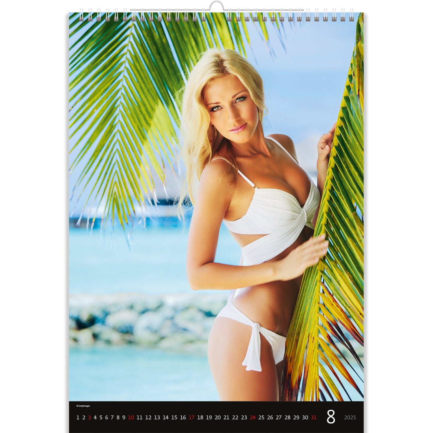 A blonde in a white bikini on the beach. Sexy Women Calendar 2025 captures the essence of summer with sun-kissed beauty and effortless allure, showcasing stunning seaside moments that radiate confidence and charm.